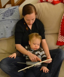 Reading on the couch. Logan is more into the book than his face lets on. Really.