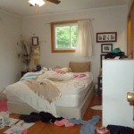 disorganized bedroom, cluttered bedroom, messy bed, messy floors, unfolded laundry