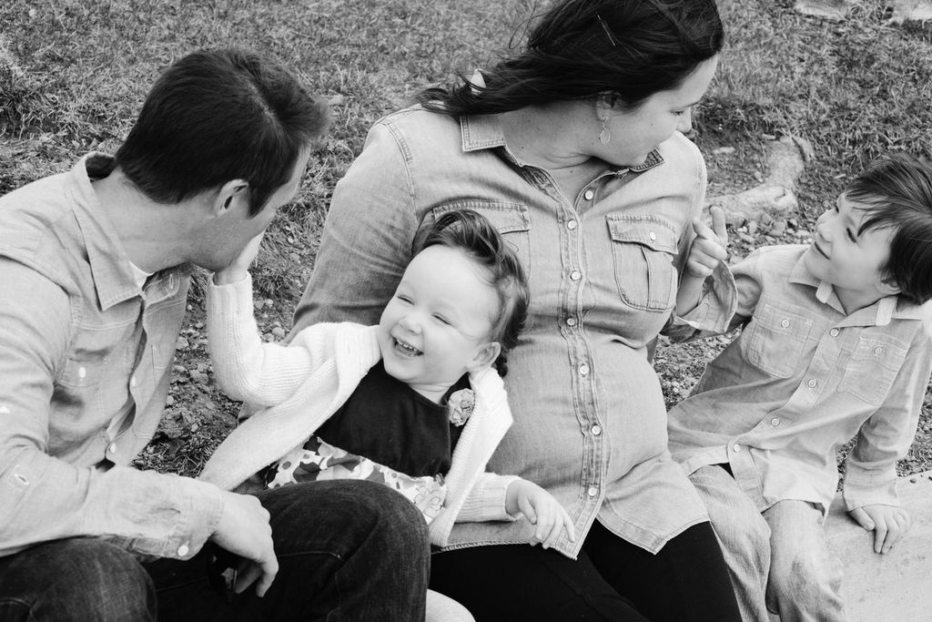 Family photo, family photo shoot, Family picture on rocks, family picture by a lake