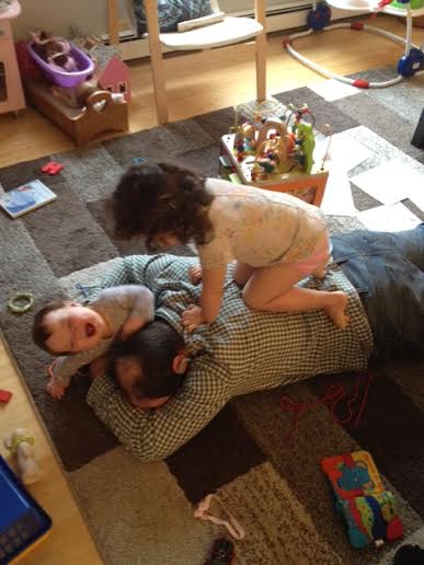 dad wrestling with kids