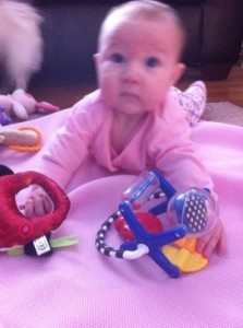 baby, baby girl, baby girl playing on floor, baby toys