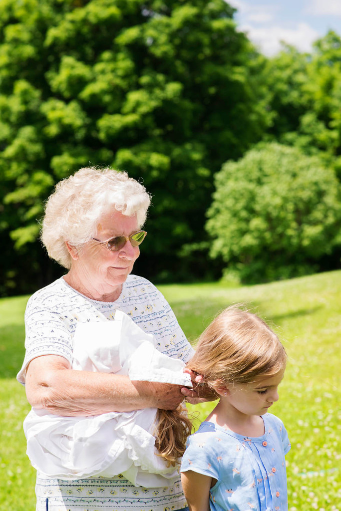 woman, girl, grandmother, granddaughter, hair braiding