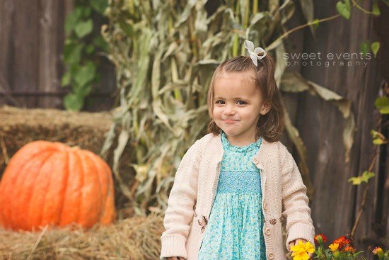 Sweet Events Photography, little girl, pumpkins, corn field, little girl holding a flower, little girl with a bow in her hair