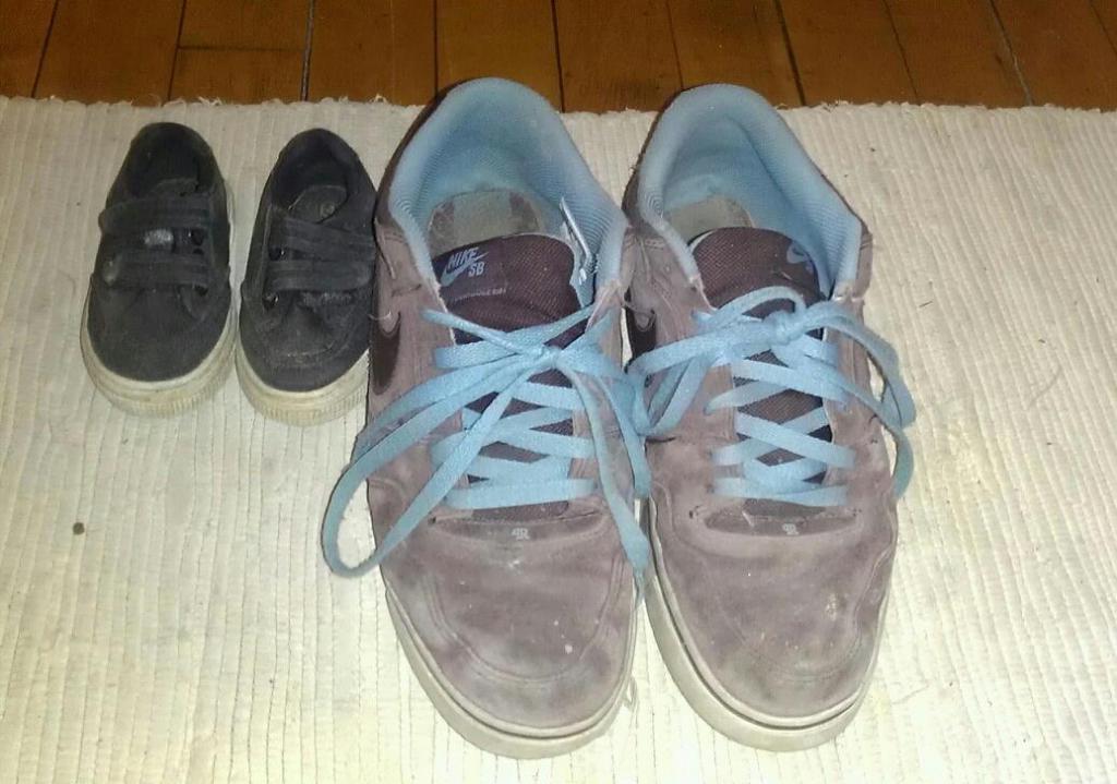 Caleb's first shoes next to his current shoes