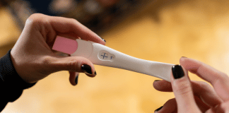 I Can’t Be Pregnant, I Had My Tubes Tied! This is the featured image for a blog post about getting pregnant after having your tubes tied. It shows a positive pregnancy test.