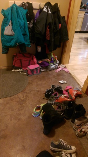 Messy mudroon with shoes and jackets