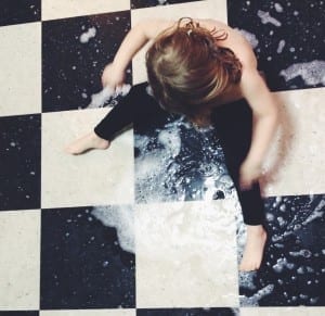 Toddlers cleaning the floor
