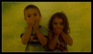 children, hands on mouth