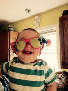 baby, sunglasses, clock on wall