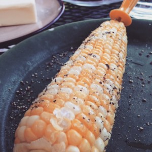 Corn on the cob with salt, pepper and butter