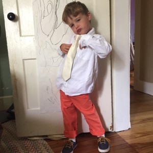 Emmet posing in a wedding outfit