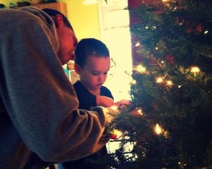 boy, dad, tree with lights