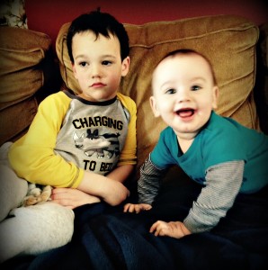 two boys, one sad one happy