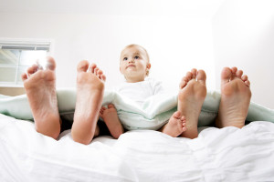 Baby in Bed with Mom and Dad