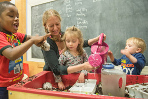 playing in sensory bin