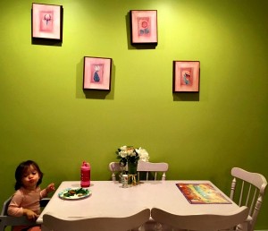child, table, picture frames