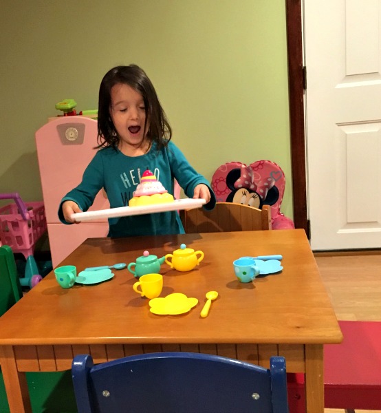 Embracing Imaginary Friends girl, table, tea set