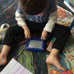 MJ plays with his busy bags