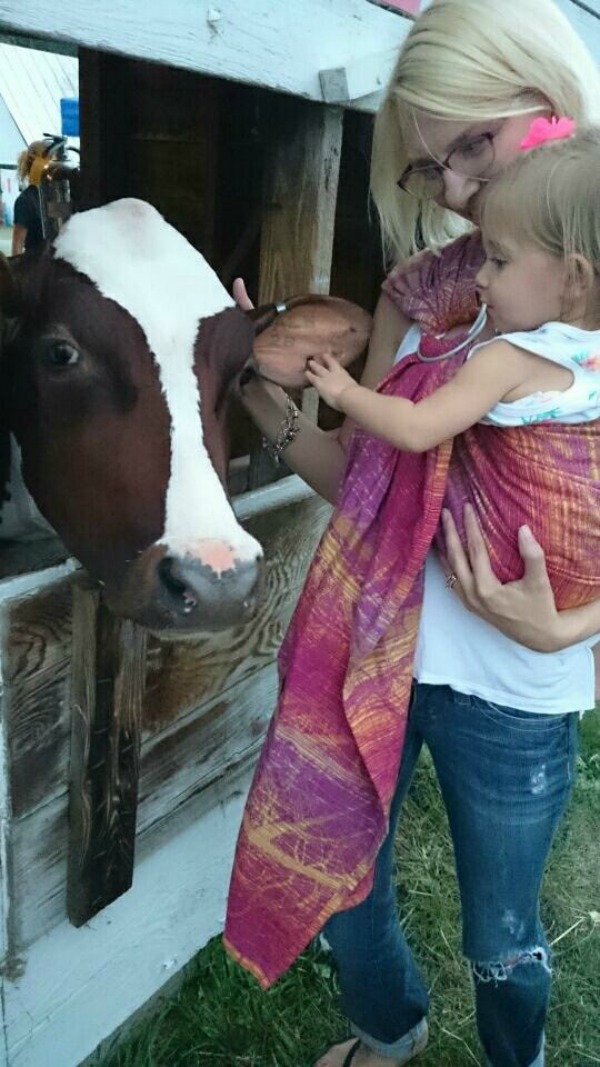 baby wearing at the farm