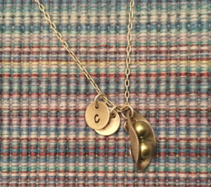 A necklace symbolizing a mother's role and identity.