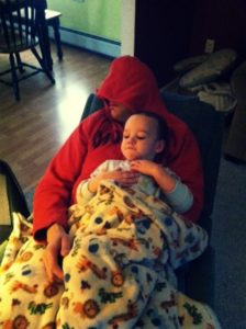 dad asleep holding son- on a mom's night out