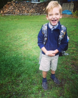 Happy little boy heading to preschool for speech and language development.