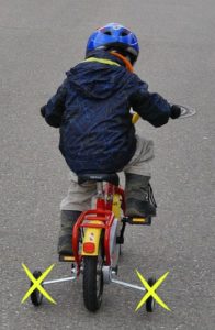 Training wheels may not help a child learn how to ride a bike.