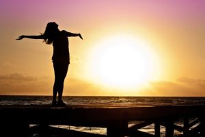 woman rejoicing finding balance and freedom
