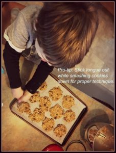 Emmet smashing breakfast cookies with a fork