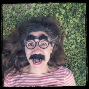 girl with fake hairy eyebrows and mustache- body hair take over!