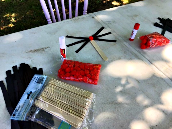 craft, table, pompoms, popsicle sticks, glue sticks, construction paper