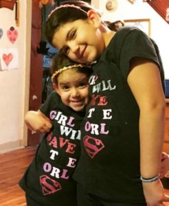 Entering the double digit years with her little sidekick, her sister.