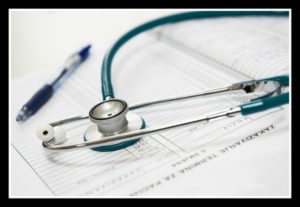 stethoscope on a medical chart