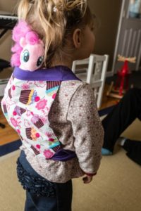 Pink Pony gets a ride in the Meh Dai carrier.