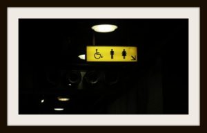 yellow bathroom sign