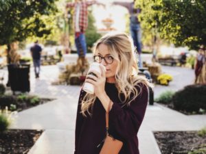 Woman sipping coffee.