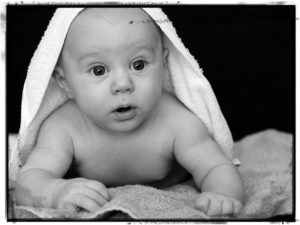 naked baby in a towel