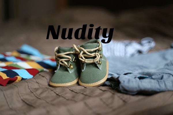 How Do We Teach Our Children About Nudity To Create Healthy Attitudes? pile of baby clothes with the word "nudity"