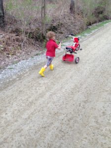 Little boy playing outside in the spring.