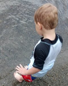 Brought our kids camping at a campground with a beach.