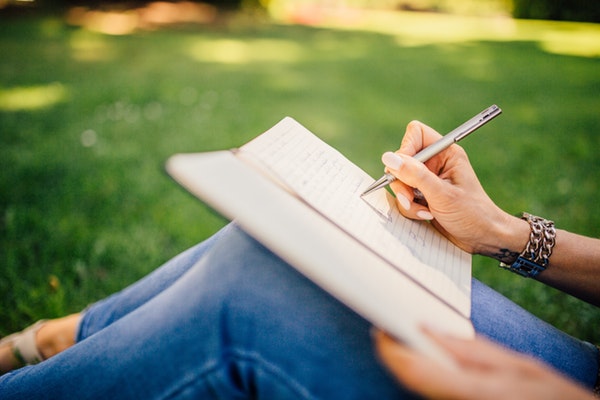 Prioritizing My Mommy Bucket List: So Much To Do, So Little Time A female making a written mommy bucket list.
