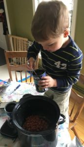 Our son cooking chili.