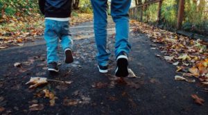 Father and son on a nature walk avoiding ticks