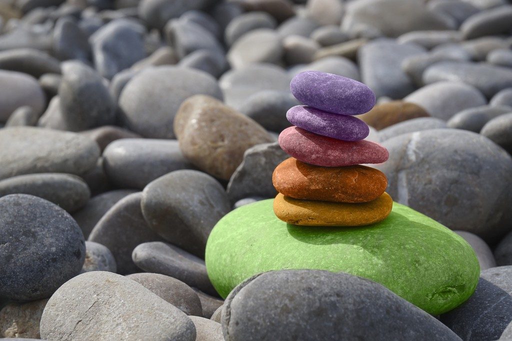 Colorful rocks stacked on one another.
