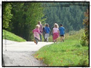 group of children hiking on a trail