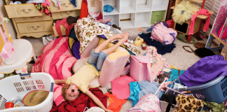 7 Tips to Clean Your Child’s Messy Room without Losing Your Mind messy bedroom with piles of clothing all over