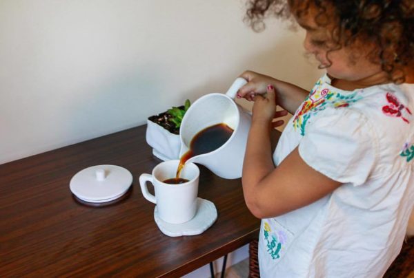 Vivid Coffee being poured by little girl