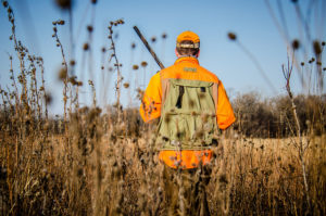 man hunting field