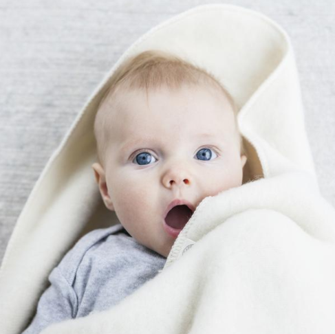 Danish Woolen blanket wrapped around baby.