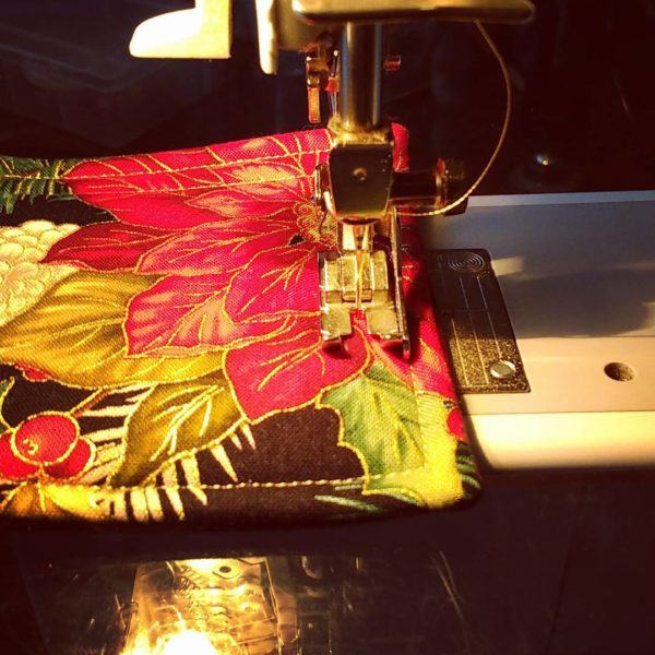Quilted Gifts from Kat’s Paws: Purr-fect Gift Ideas for the Holidays Sewing machine quilting a holiday coaster from Vermont business Kat's Paws